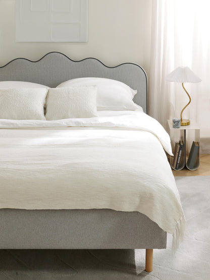 Romvira Upholstered Bed with Wavy Headboard