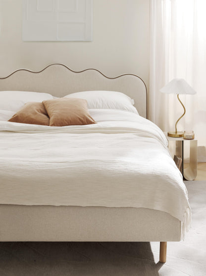 Romvira Upholstered Bed with Wavy Headboard